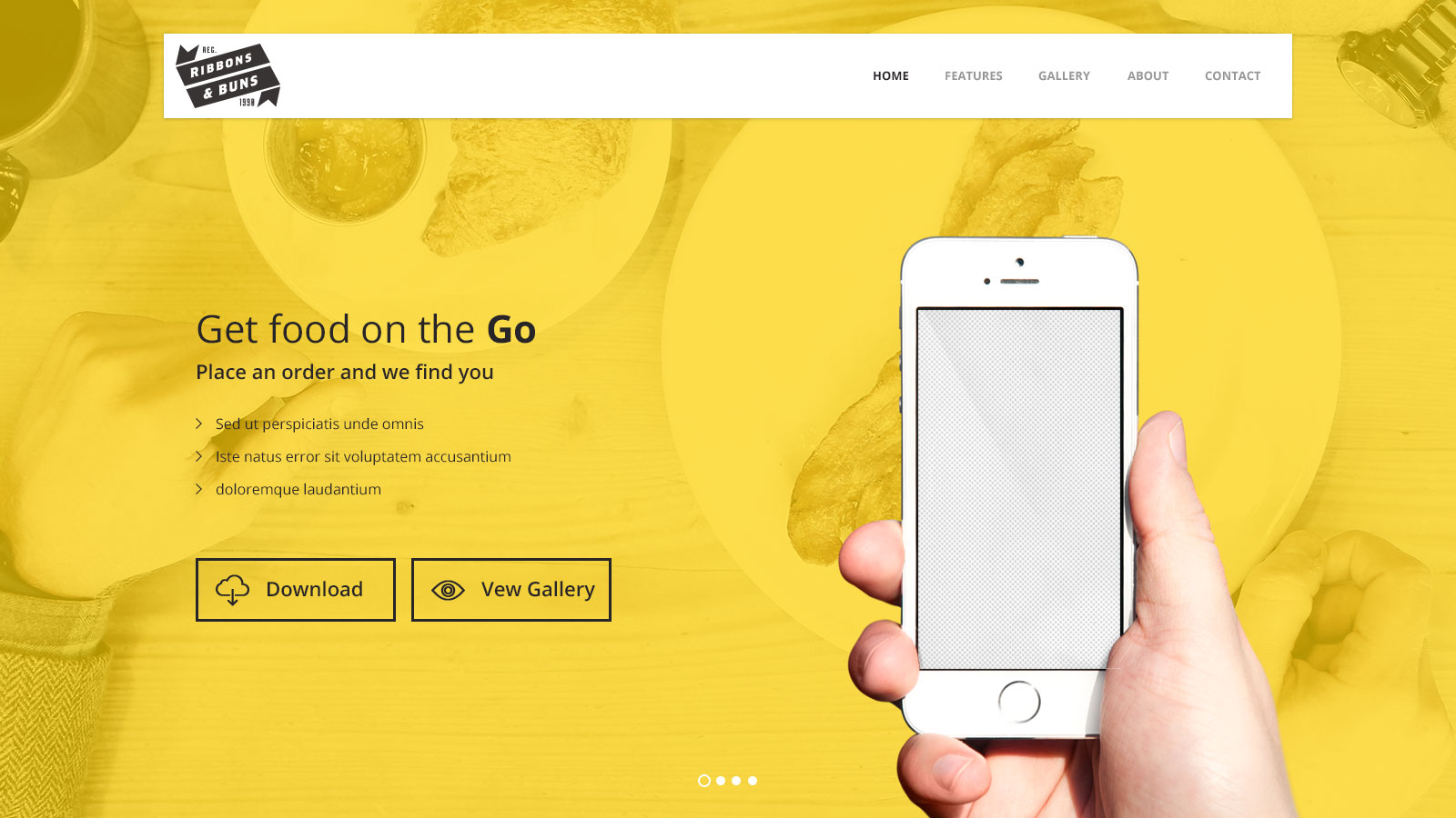 Hand holding smartphone on yellow background.